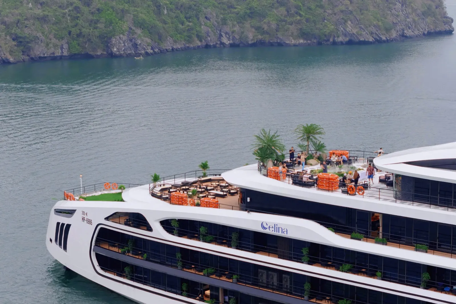 The Celina sundeck with palms and loungers seen from above