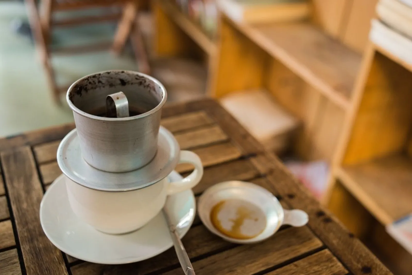 Vietnamese drip coffee brewing in a phin filter