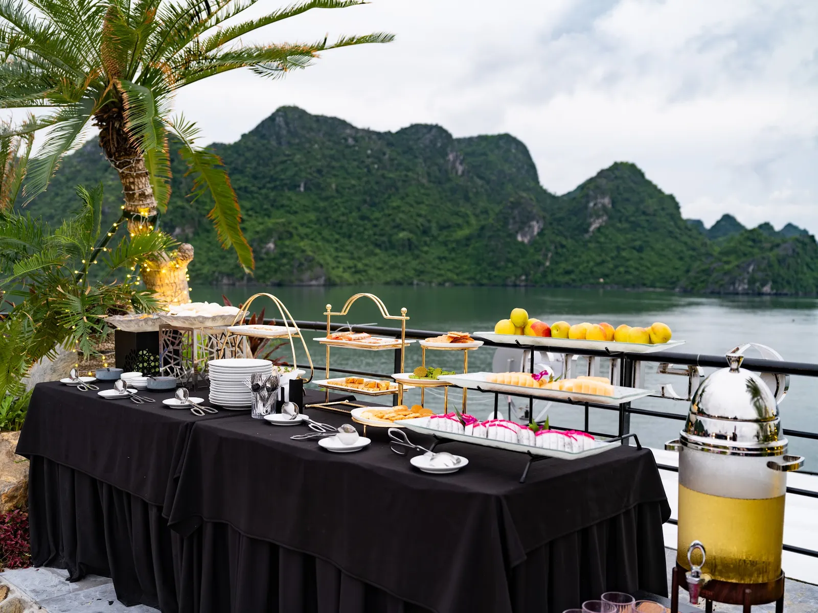 Afternoon tea set out on deck facing the islands